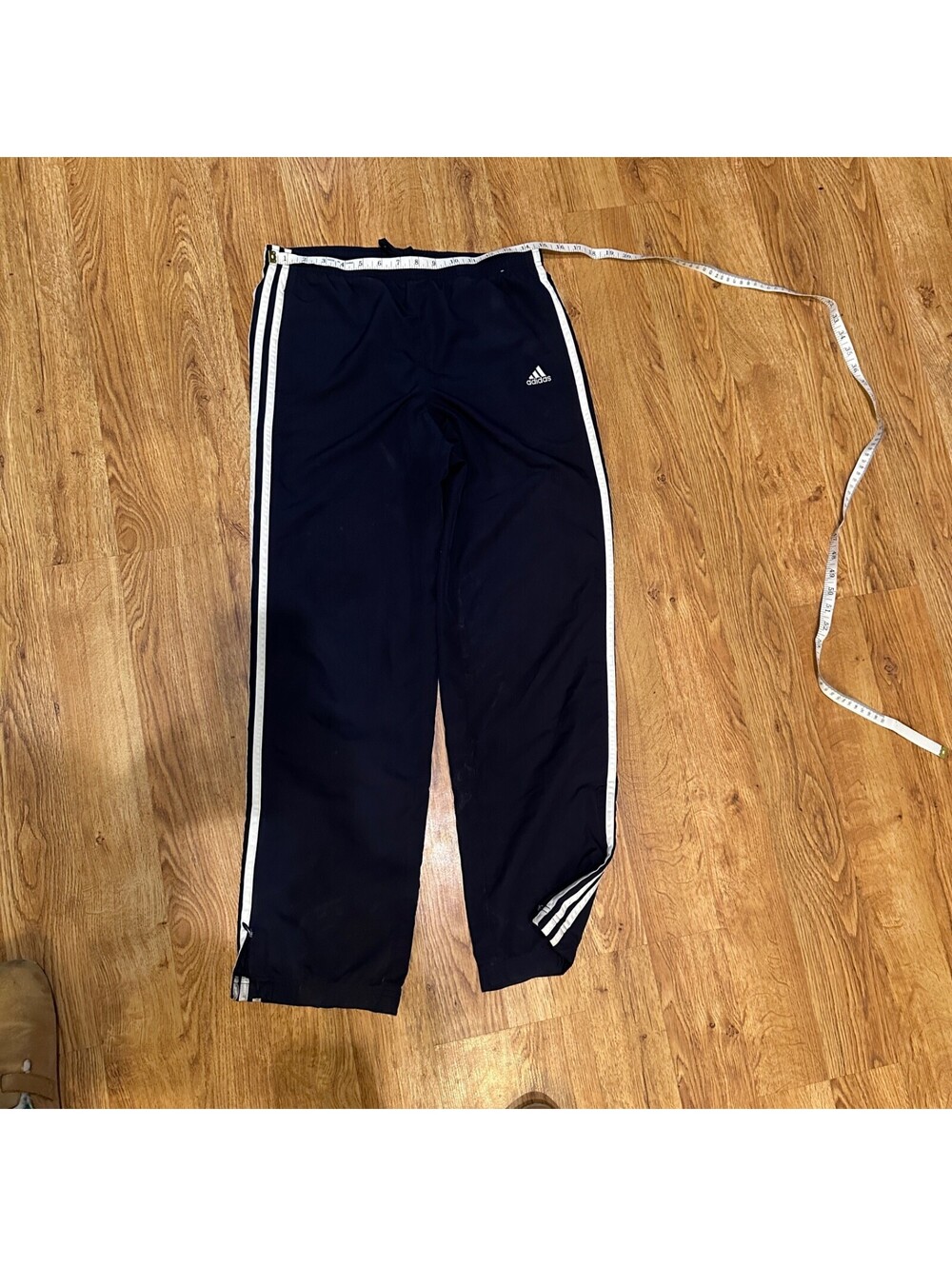Adidas USA Women's size small blue with white stripe, zipper at bottom of leg